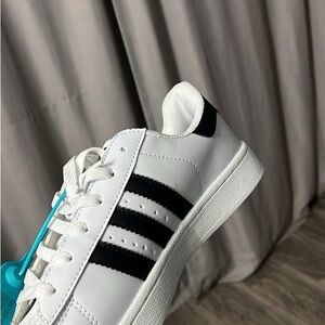 White Sneakers with Black Stripes